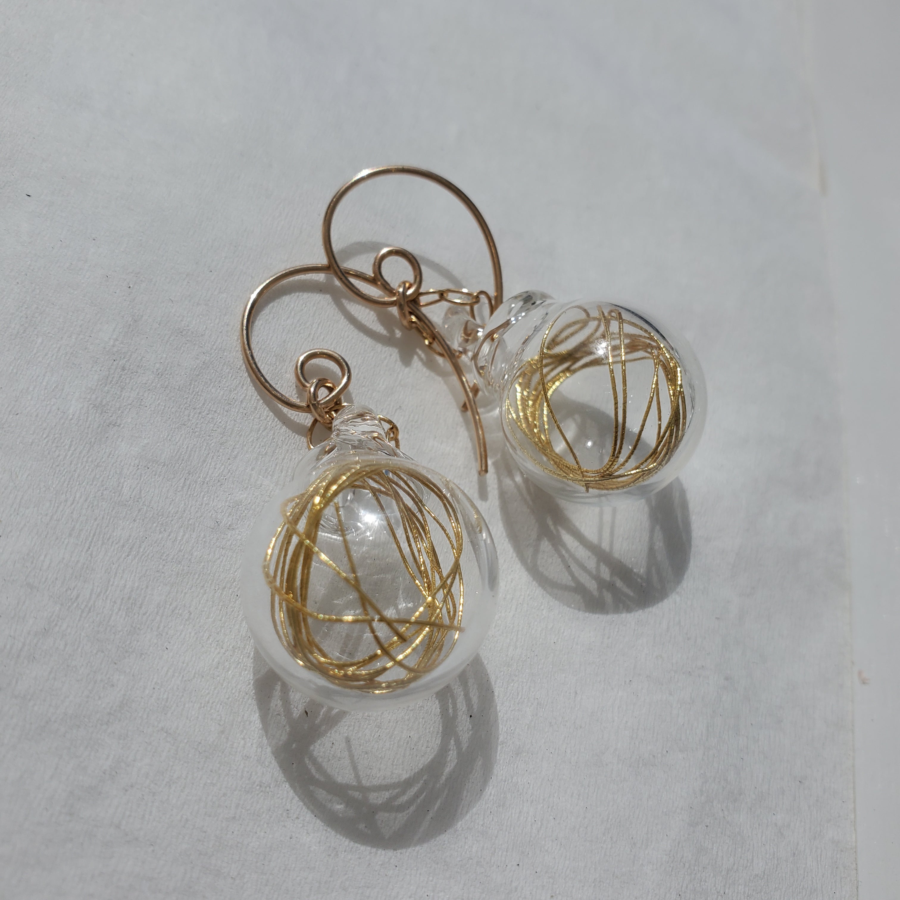 Gold thread earrings