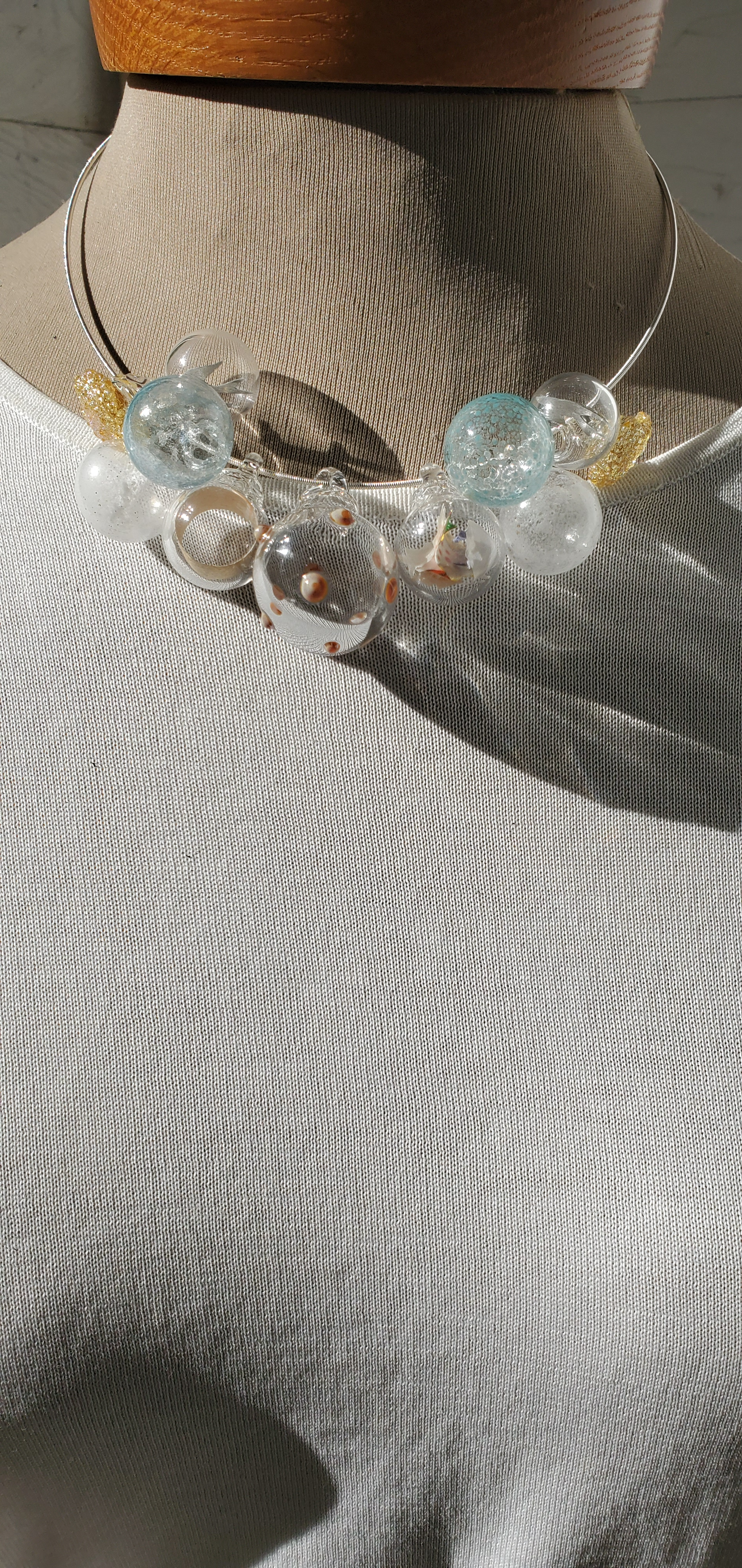 clear, gold, soft blue necklace