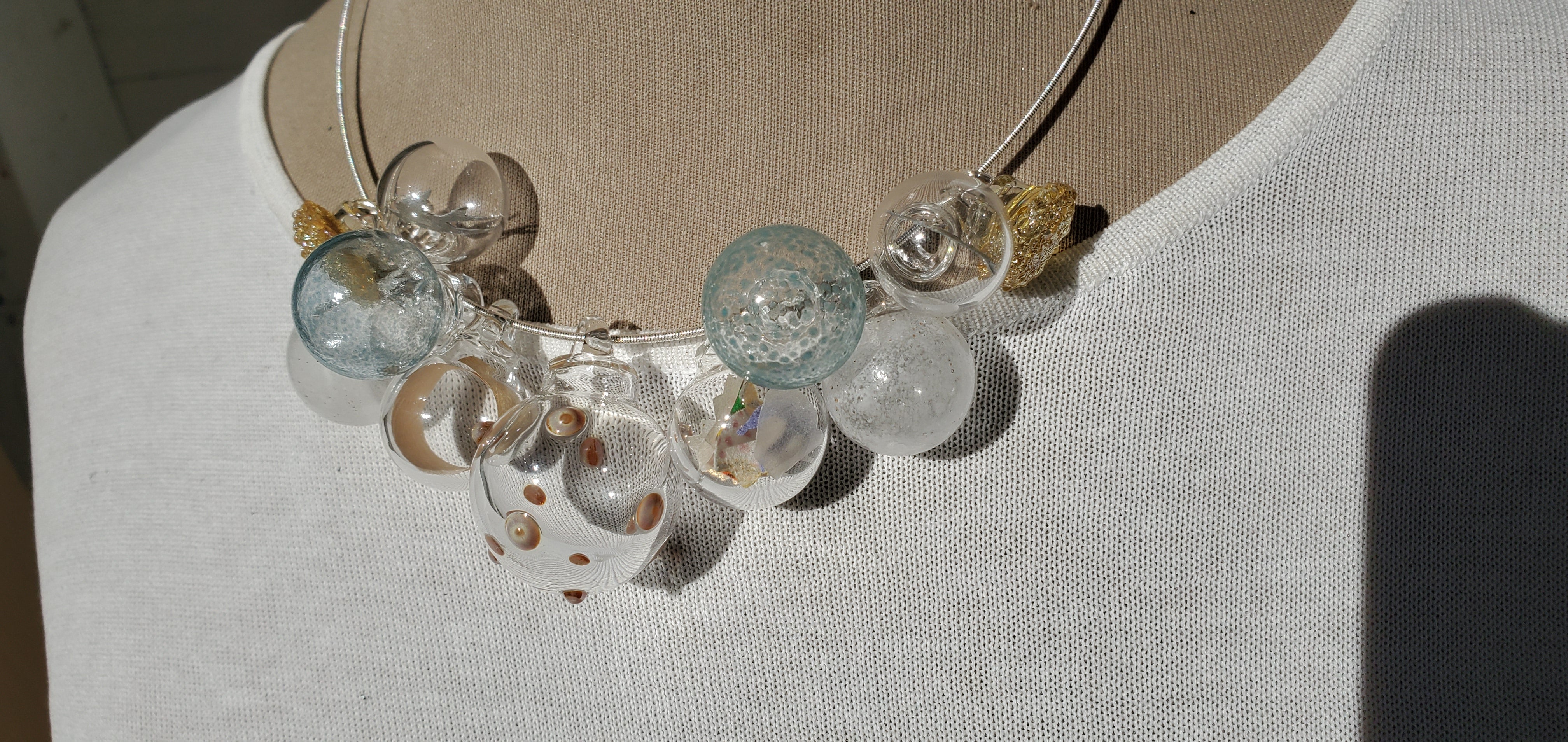 clear, gold, soft blue necklace